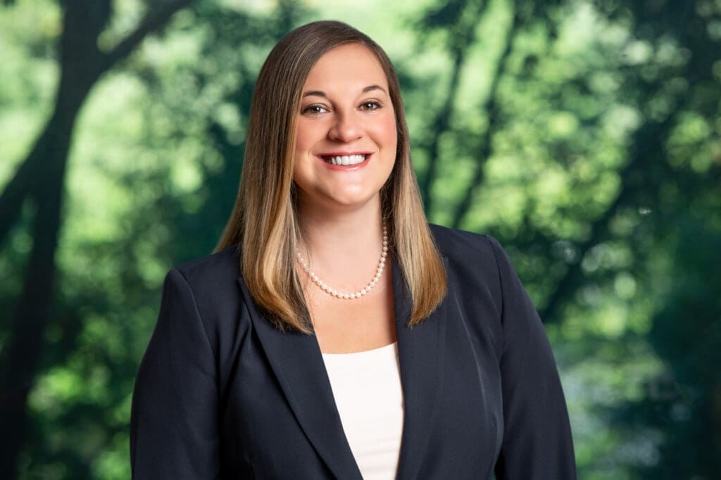 Jennifer Fleming, an attorney licensed in Georgia, Pennsylvania, and New Jersey, known for her recognition as a Top 10 Best Attorney and "Rising Star." She enjoys working face-to-face with clients and volunteers at shelters in her free time.