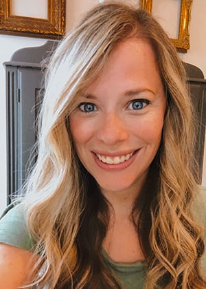 Smiling young blonde woman with blue eyes, alt text for injury attorney website, SEO friendly