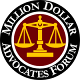 Scales of justice logo for Million Dollar Advocates Forum, prestigious group of top trial lawyers.