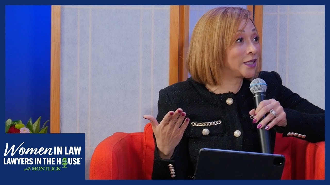 Professional woman speaking at a "Women in Law" event, discussing female lawyers serving in government