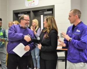 Group discusses personal injury case with lawyer in office, emphasizing client consultation