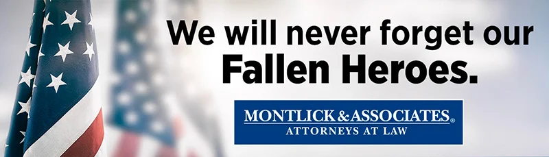 fallen-heros-banner-a359eee9e276c8abc6d0172e2daa3ca7 American flag with "We will never forget our Fallen Heroes" text for law firm Montlick & Associates