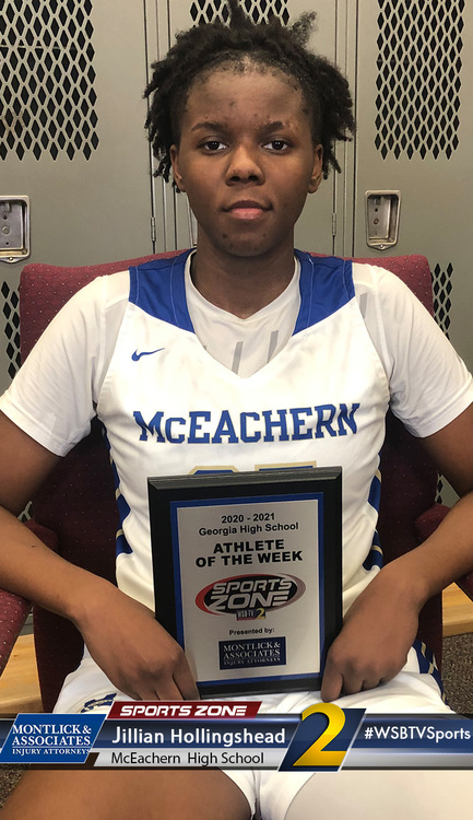 Athlete of the Week Jillian Hollingshead from McEachern High School holds award, sponsored by Sports Zone.