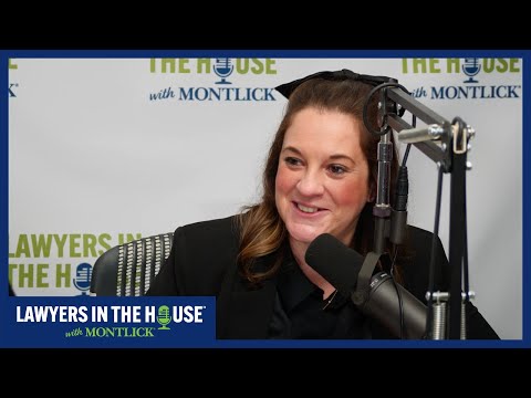Smiling female lawyer speaking into microphone at Lawyers in the House event, SEO alt text for attorney website