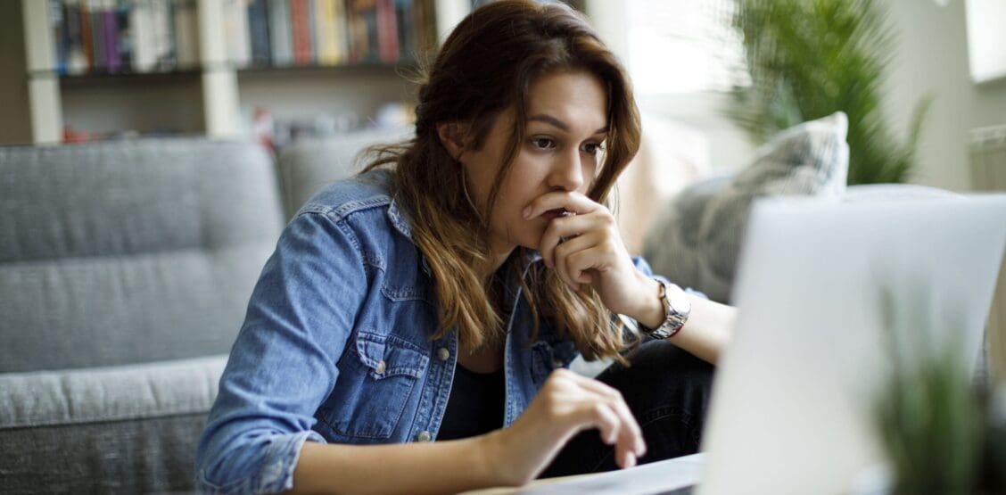 Worried young woman researching what to do after an accident