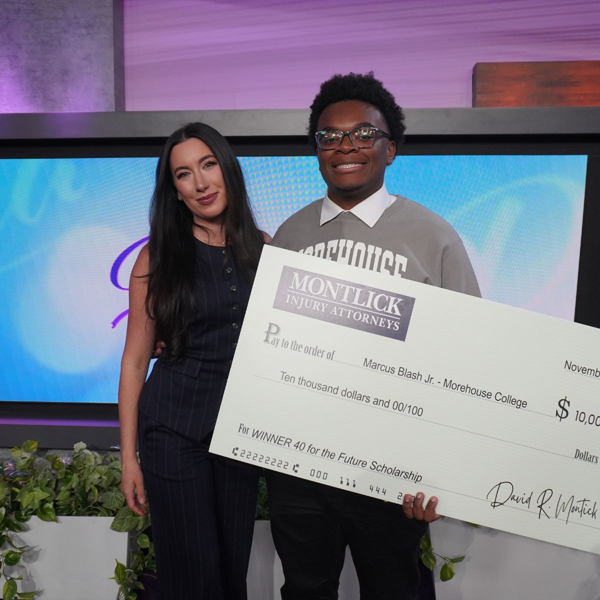 40 for the Future scholarship winner Marcus Blash Jr, seen here receiving a scholarship check from Nikki Montlick