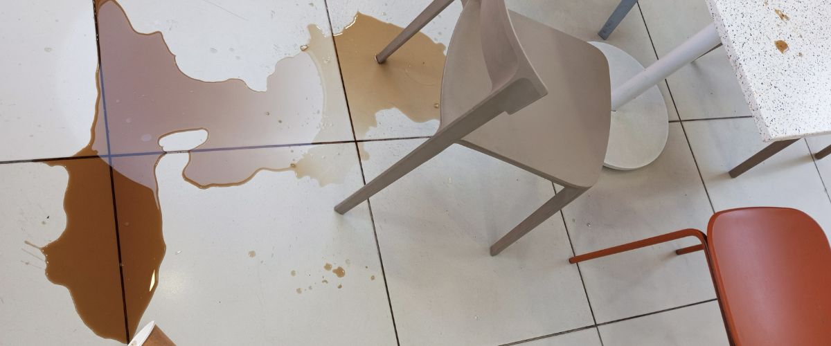 Coffee spilled on the floor of a restaurant